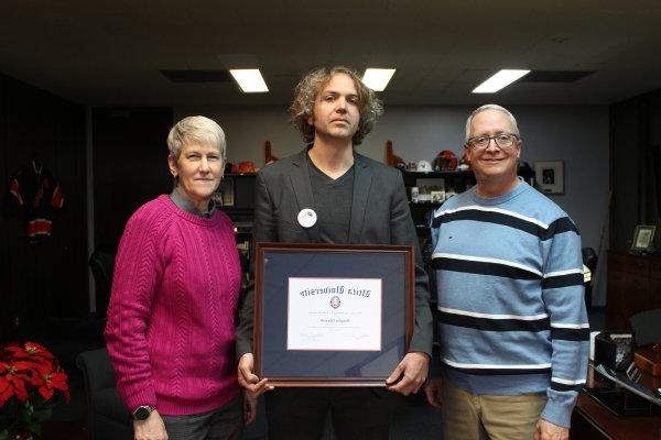 Douglas Edwards, with the 2023 Harold T. Clark Award, stands between President Todd Pfannestiel and Interim Provost Stephanie Nesbitt.